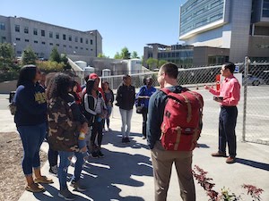 Students listening to a speaker