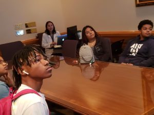 Students listening to a speaker