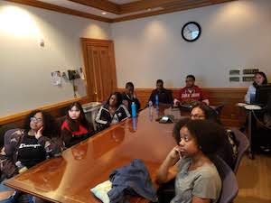 Students listening to a speaker