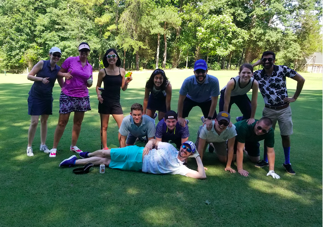 Trainees posing on golf course