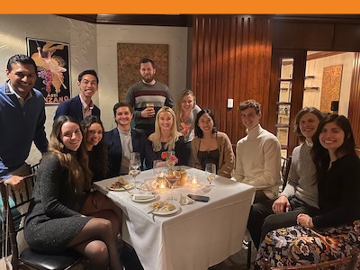 People at a party gathered around a table
