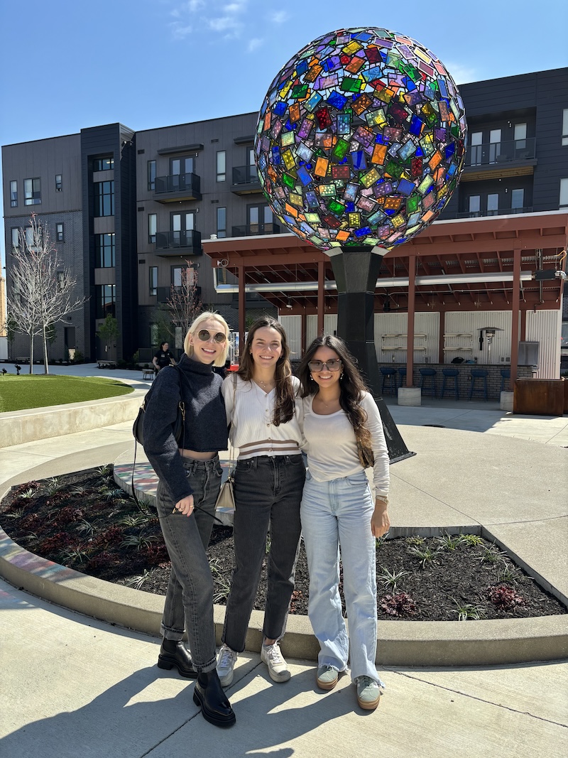 Three people outside