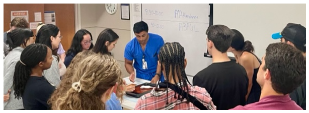 Participants in the primer course watch a demonstration