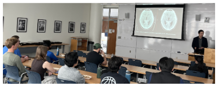 Classsroom with presenter at front and students in seats