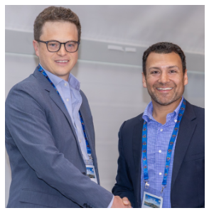 Dr. Gupta shaking hands with another person