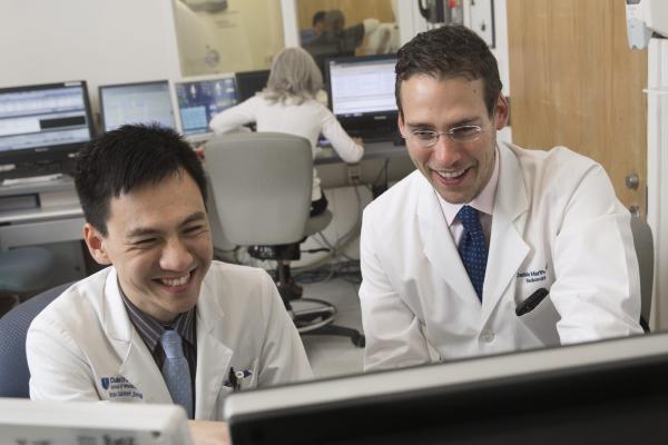 Photo of two doctors looking at computer together