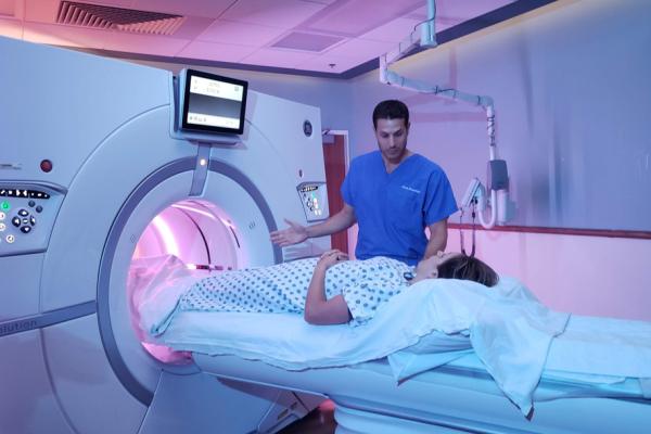 Person receiving an MRI speaking with doctor