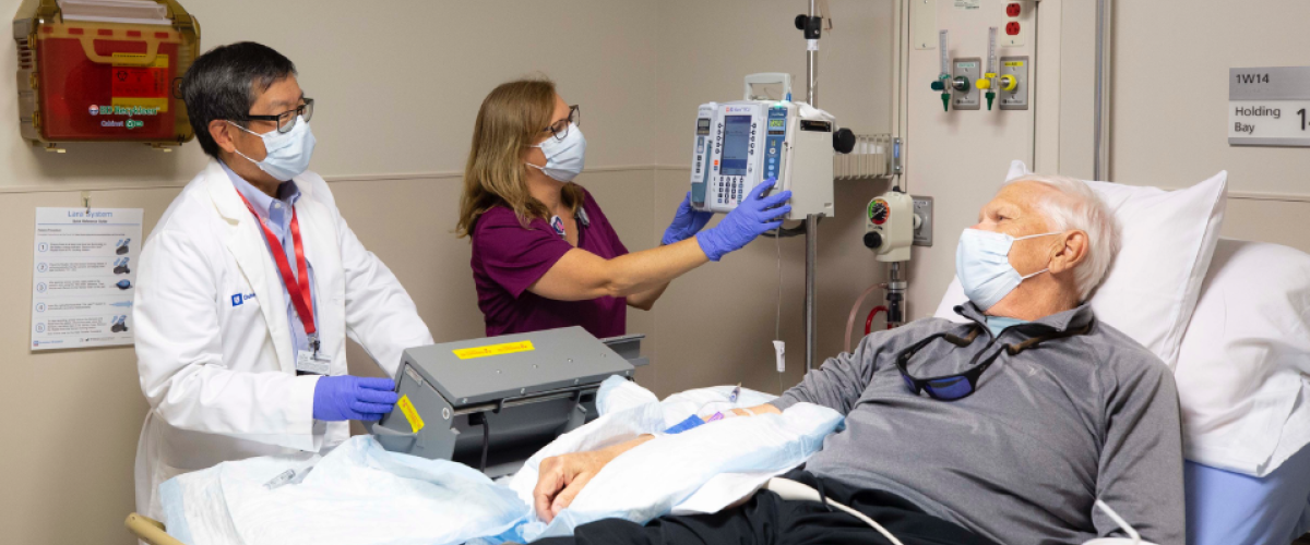 Terence Wong and patient receiving Pluvicto