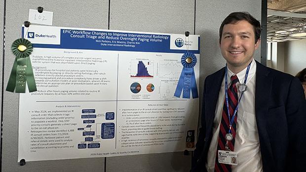 Dr. Perkons with his research poster