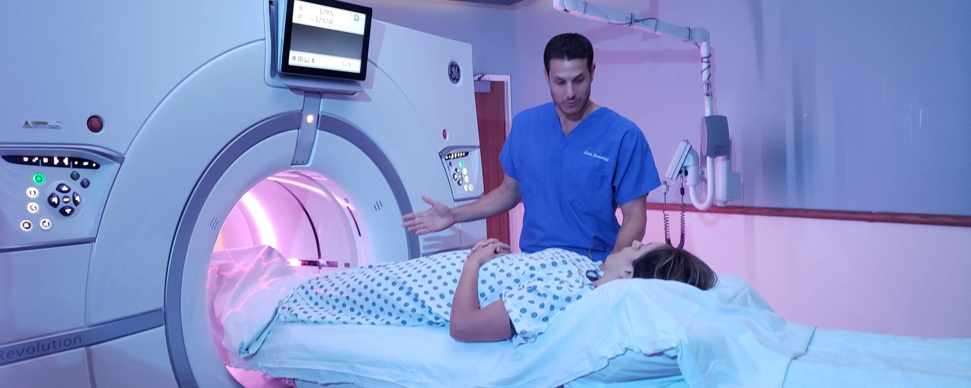 Radiologist and patient on scanner