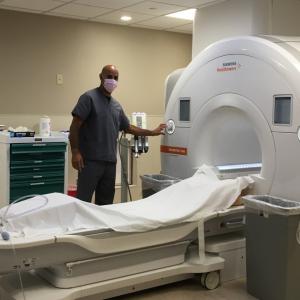 Pic of MRI tech with MRI machine